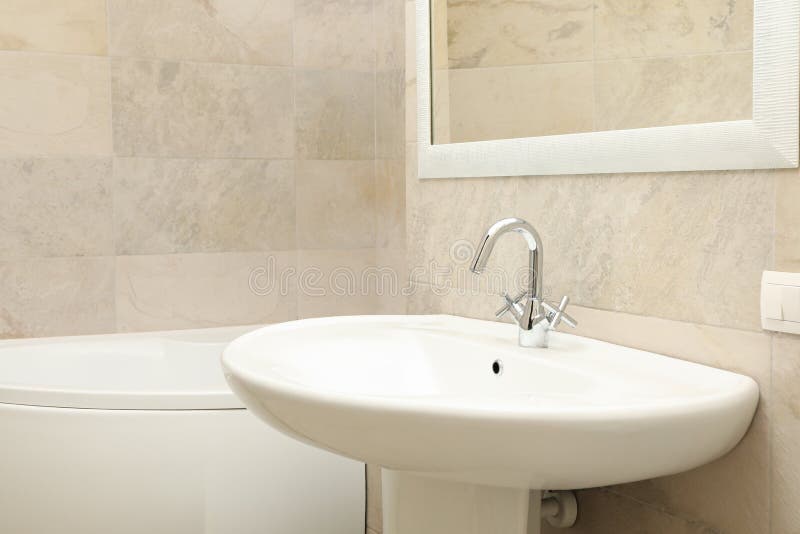Sink in Modern Comfortable Bathroom in Light Beige Color Stock Image