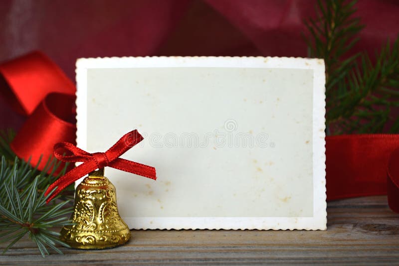 Sino de Natal e quadro vazio da foto do Natal do vintage imagens de stock royalty free Sino de Natal e quadro vazio da foto do Natal do vintage imagens de stock royalty free