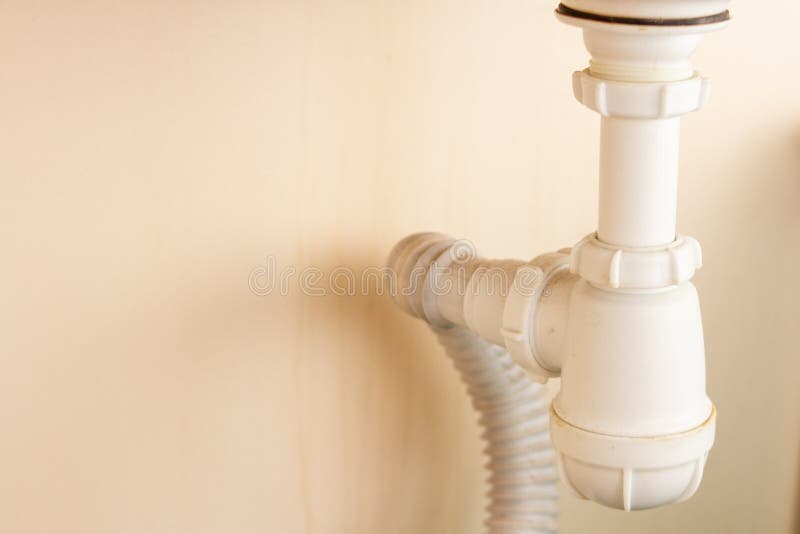 Siphon Plastic Bent Curved Pipe Under the Sink. Elbow Stock Image