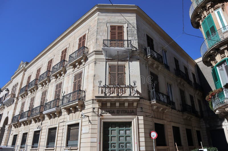 Syracuse, Sicily, Italy - August 26, 2020: Palazzo Platamone or Palazzo dell`Orologio in Piazza Archimede, headquarters of the Bank of Italy. Syracuse, Sicily, Italy - August 26, 2020: Palazzo Platamone or Palazzo dell`Orologio in Piazza Archimede, headquarters of the Bank of Italy