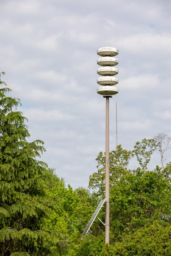 Emergency Siren Tower Alerting Tornado Warning in Rural Area Stock