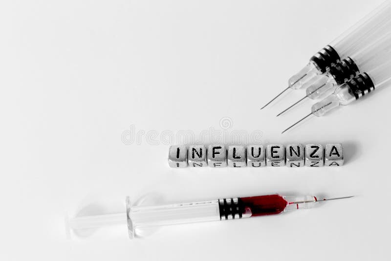 Siringhe e sangue con l'influenza di parola fotografie stock libere da diritti Siringhe e sangue con l'influenza di parola fotografie stock libere da diritti