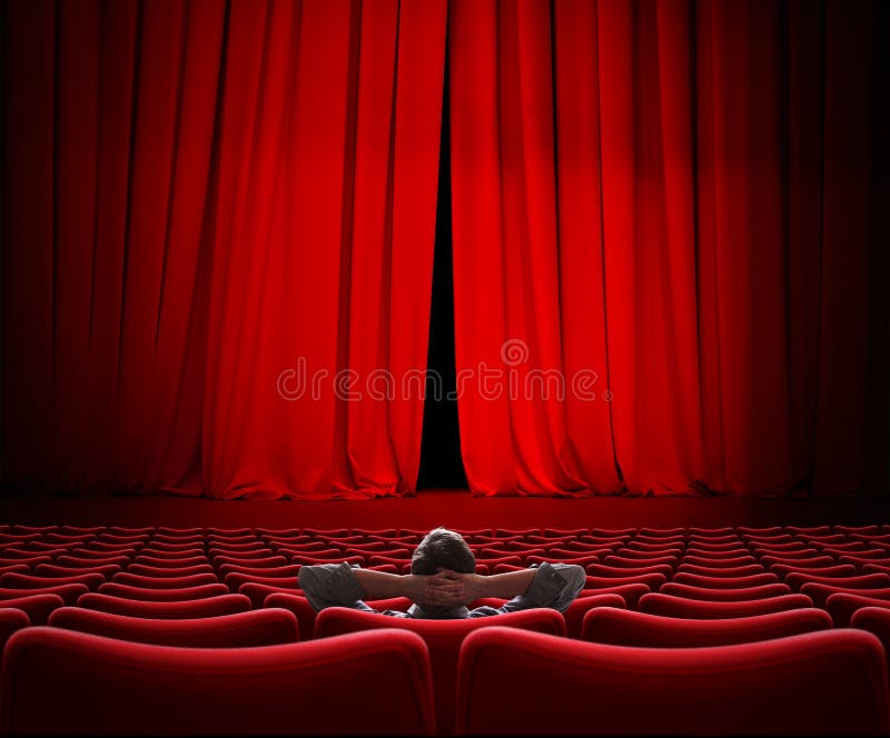 Man sitting alone in VIP movie theater hall. Man sitting alone in VIP movie theater hall