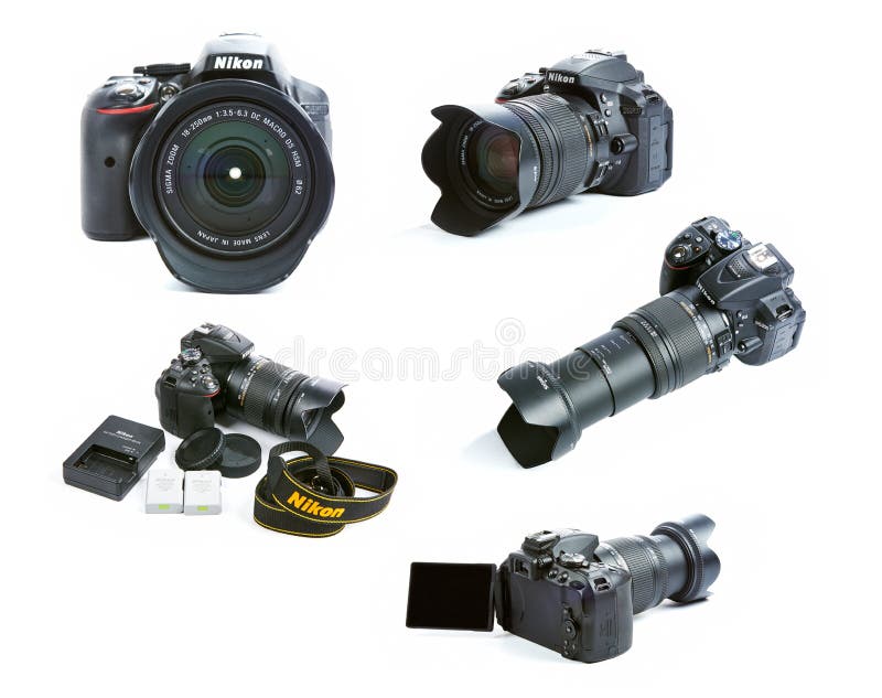 Sistema de imágenes del sistema de la cámara de Nikon D5300 DSLR con la lente, las baterías y el cargador de la sigma del enfoque fotos de archivo Sistema de imágenes del sistema de la cámara de Nikon D5300 DSLR con la lente, las baterías y el cargador de la sigma del enfoque fotos de archivo