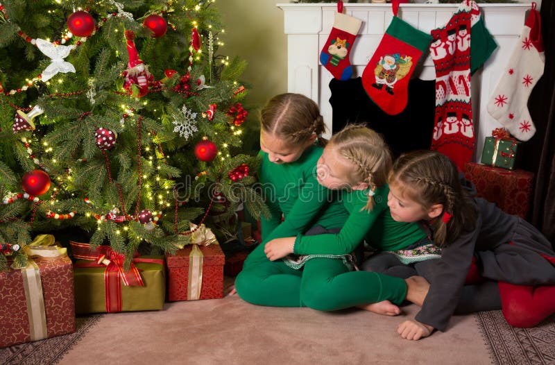 Sisters at the christmas tree royalty free stock photo Sisters at the christmas tree royalty free stock photo