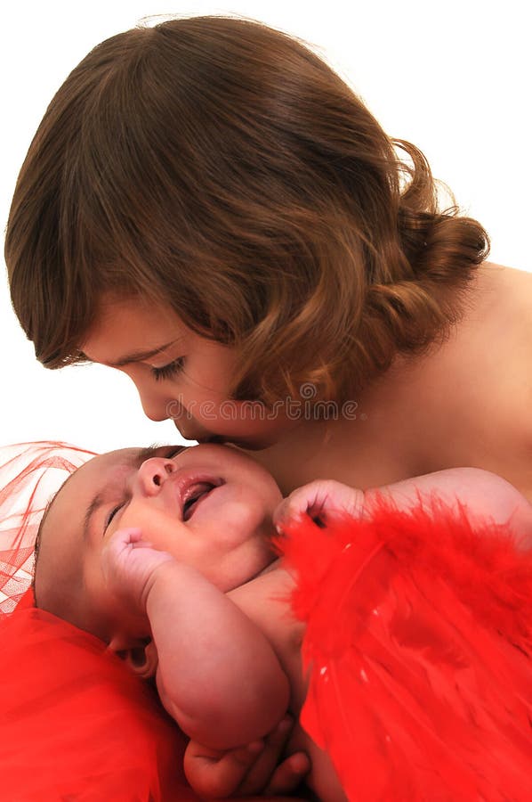 Sisters playing and and wearing angle wings