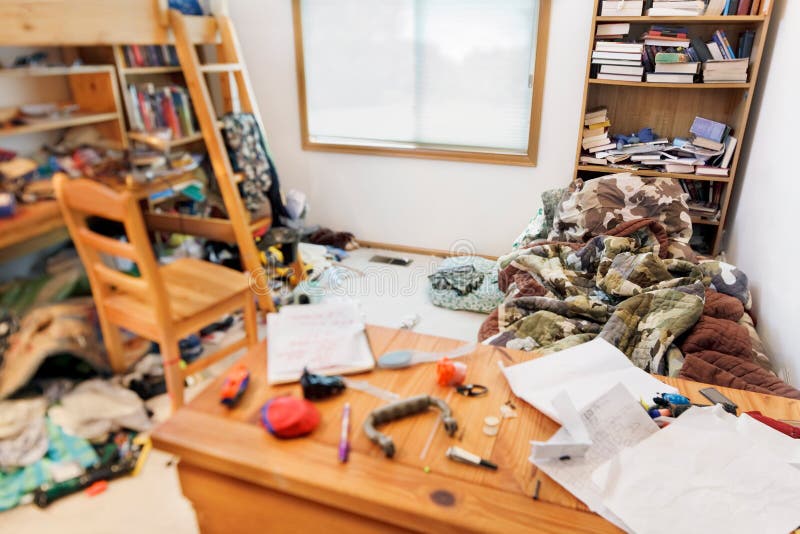 Teenage boys messy room. Tilt shift lens, with focus on pillow & comforter. Teenage boys messy room. Tilt shift lens, with focus on pillow & comforter