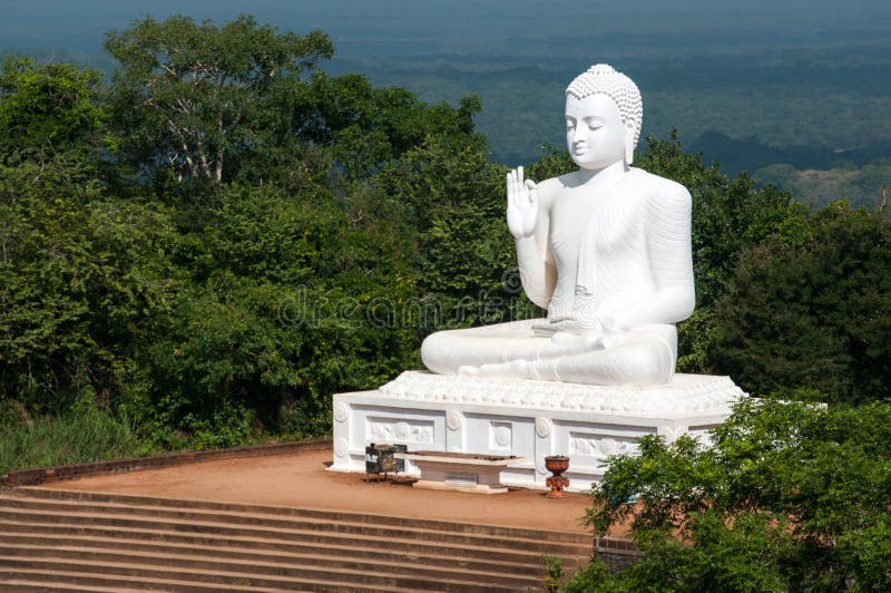 White sitting Buddha statue in Mihintale, Sri Lanka. Pillar column garden stock images, royalty-free photos and pictures