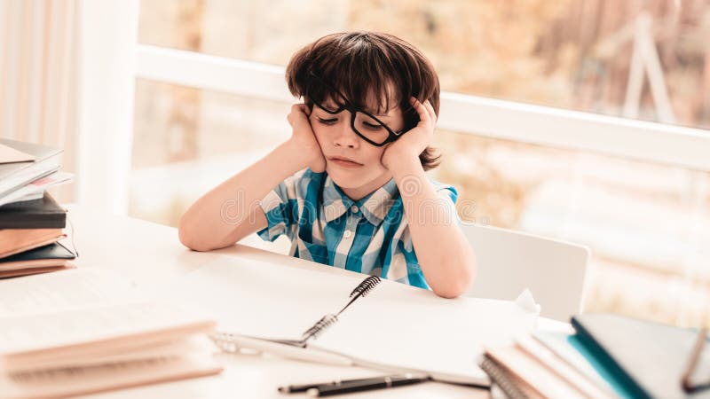 Sitting Little Boy In Glasses Doing Homework. Stock Image ...