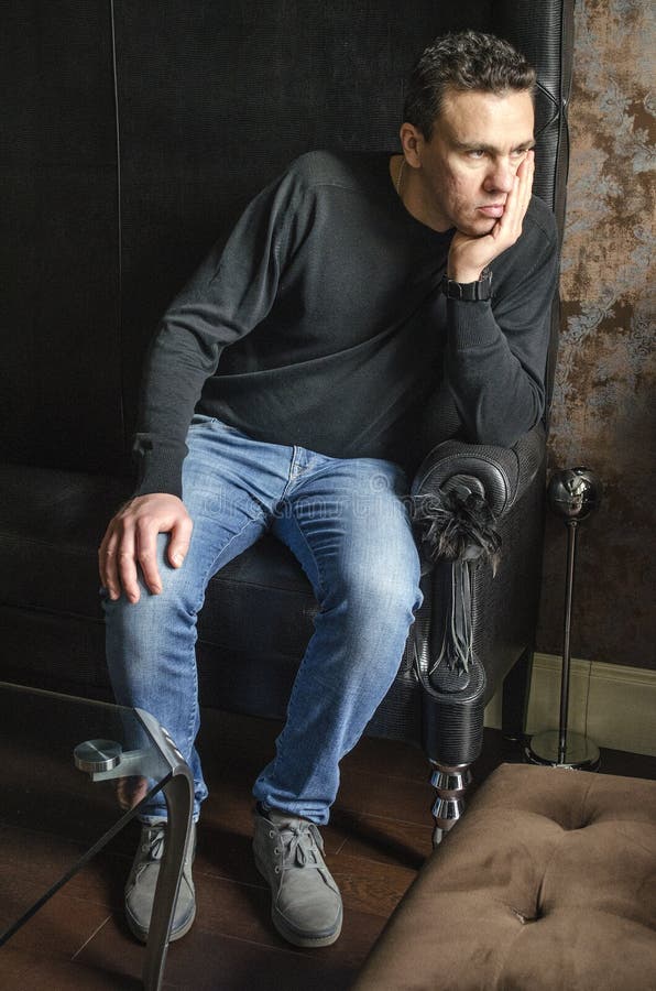 black sweater blue jeans