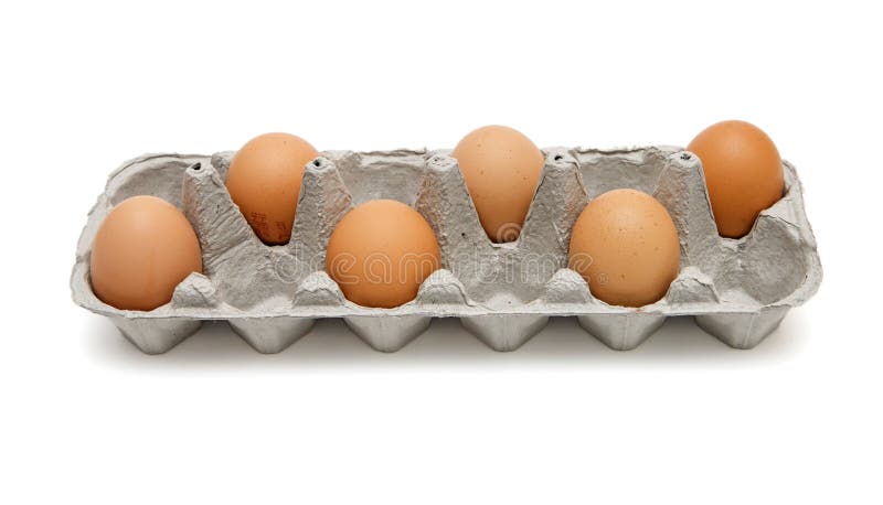 Six brown eggs in box isolated