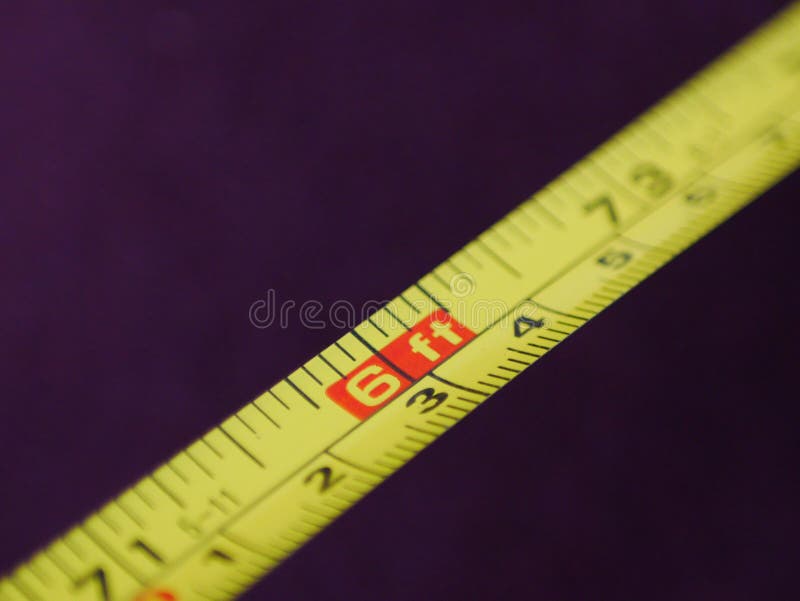 Close up of six feet marking on a yellow tape measure