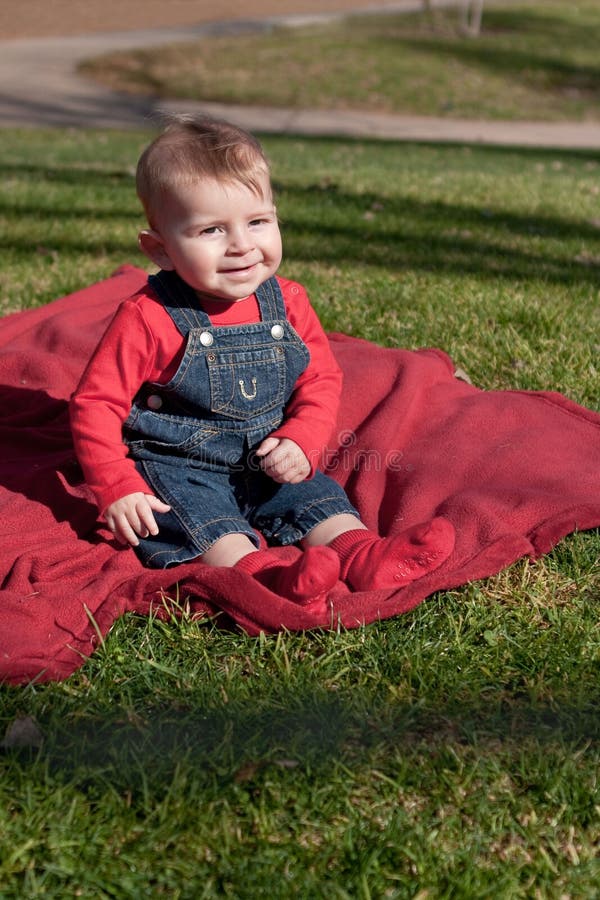 Download Six-month Old Boy On Red Blanket On Grass Stock Photo ...