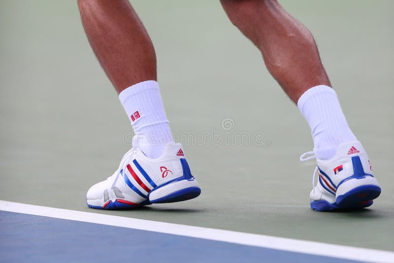 Six times Grand Slam champion Novak Djokovic wears custom Adidas tennis shoes during match at US Open 2014