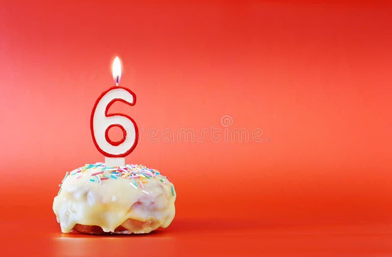 Six Years Birthday. Cupcake With White Burning Candle In The Form Of