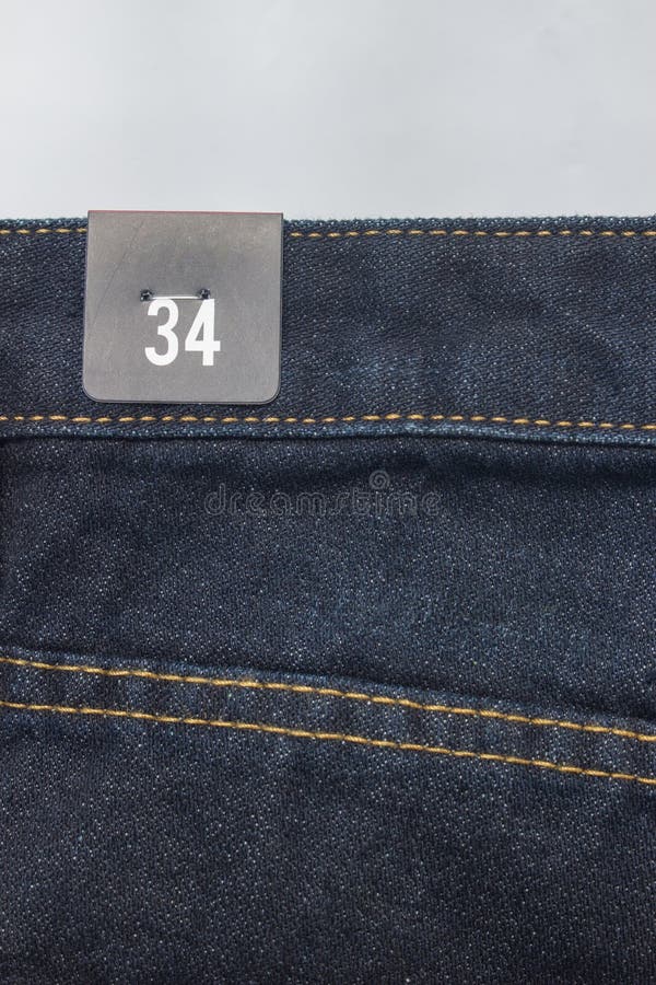 Size label on jeans stock photo. Image of clothing, back - 63404124