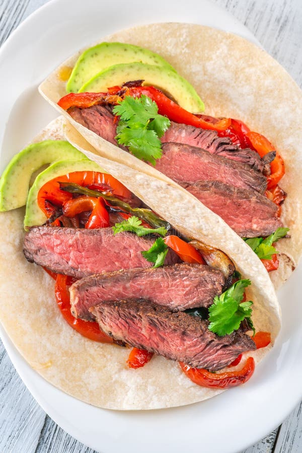 Sizzling Steak Fajitas stock image. Image of fajitas 303637251