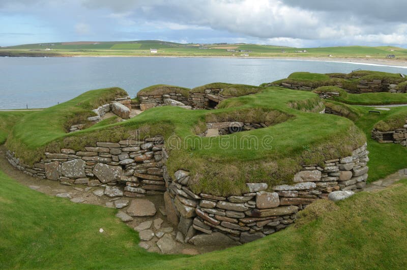 Skara Brae is a stone-built Neolithic settlement, located on the Bay of Skaill on the west coast of Mainland, the largest island in the Orkney archipelago of Scotland. Consisting of eight clustered houses, it was occupied from roughly 3180 BC to about 2500 BC. Europe`s most complete Neolithic village, Skara Brae gained UNESCO World Heritage Site status as one of four sites making up `The Heart of Neolithic Orkney`. Older than Stonehenge and the Great Pyramids, it has been called the `Scottish Pompeii` because of its excellent preservation. Skara Brae is a stone-built Neolithic settlement, located on the Bay of Skaill on the west coast of Mainland, the largest island in the Orkney archipelago of Scotland. Consisting of eight clustered houses, it was occupied from roughly 3180 BC to about 2500 BC. Europe`s most complete Neolithic village, Skara Brae gained UNESCO World Heritage Site status as one of four sites making up `The Heart of Neolithic Orkney`. Older than Stonehenge and the Great Pyramids, it has been called the `Scottish Pompeii` because of its excellent preservation.