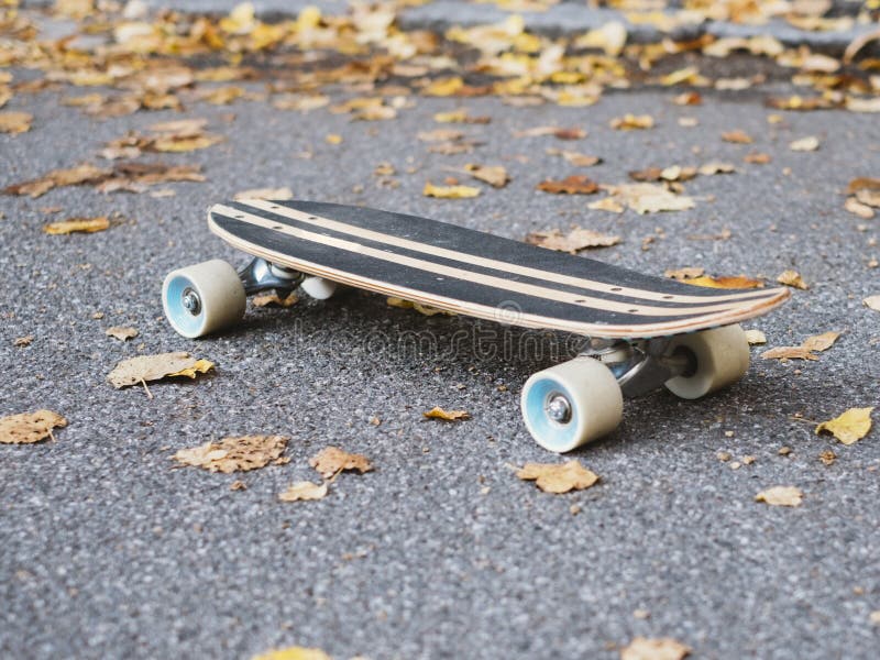 Skateboard isolated on the ground. Shallow depth of field.