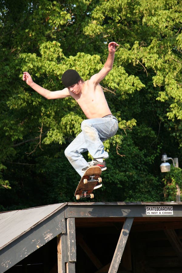Skateboarder Going off Platform