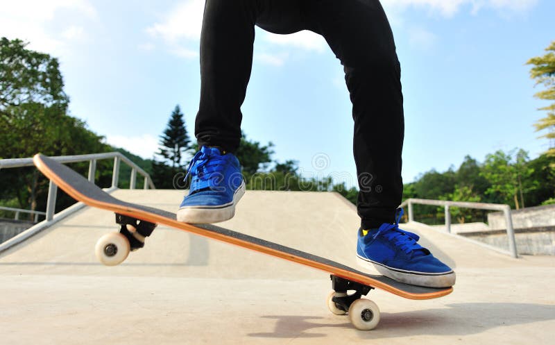 Young woman skateboarding at modern city. Young woman skateboarding at modern city