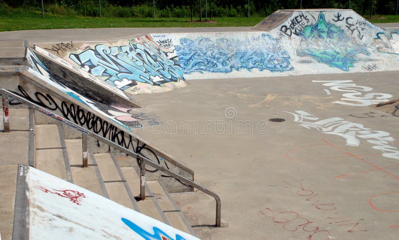 Empty outdoor skate park with graffiti. Empty outdoor skate park with graffiti