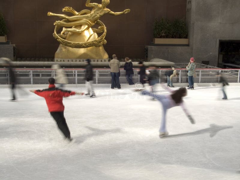 This is a blur action shot of some very good skaters at Rockefeller Center in Manhattan. This is a blur action shot of some very good skaters at Rockefeller Center in Manhattan.