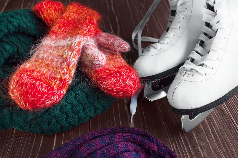 Skates for figure skating and mittens royalty free stock photos Skates for figure skating and mittens royalty free stock photos