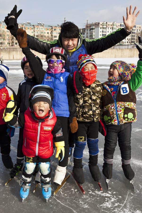 A skating coach and his team.