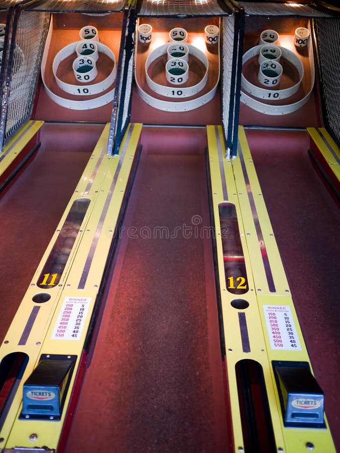 Midway carnival Skeeball bowling amusement game at an arcade. Midway carnival Skeeball bowling amusement game at an arcade.