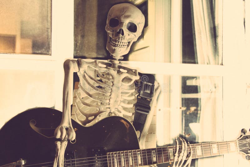 skeleton playing mandolin