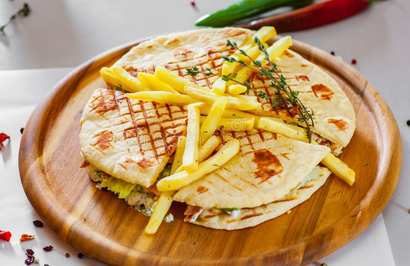 Skepasti: pork gyros with meat, tzatziki sauce, vegetables, cheese and french fries