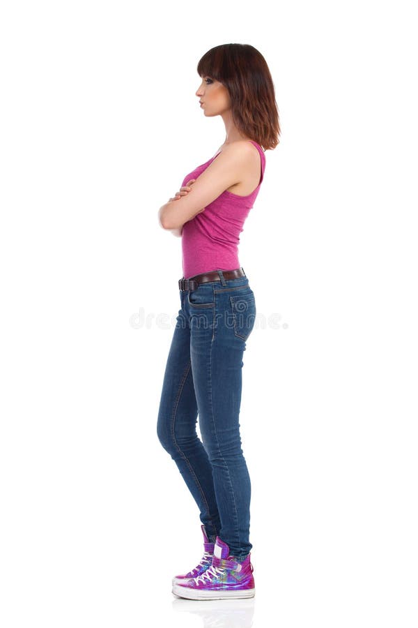 Skeptic Woman Is Standing With Arms Crossed. 