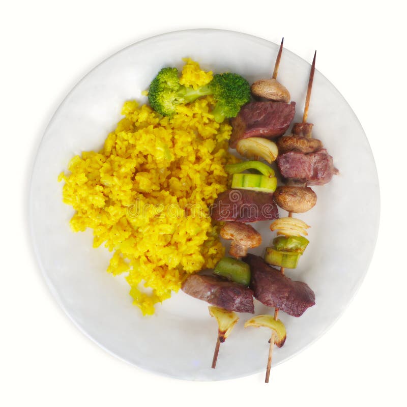 Skewer of Beef Cubes Broccoli and Rice White Background Plate Yellow Turmeric Stock Photo