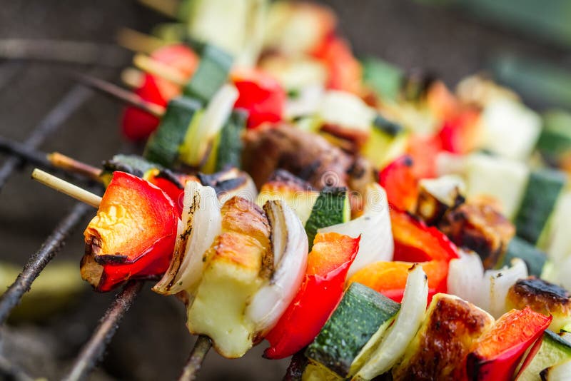 Closeup of skewers with chicken and vegetables on the grill. Roasted skewer grill stock images, royalty-free photos and pictures