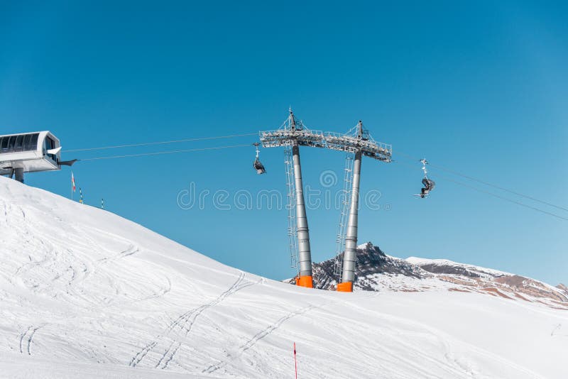 The ski lifts durings bright winter day. Chairlifts, outdoor.