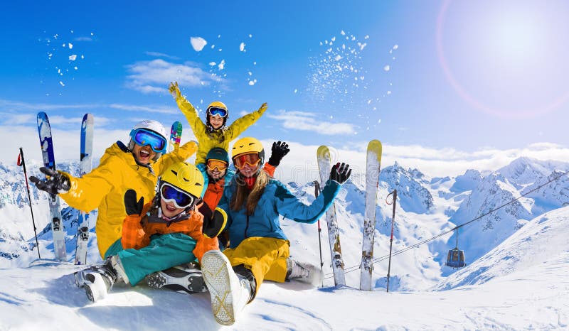 Ski in winter season, mountains and ski family on the top in sunny day in France, Alps above the clouds. Ski in winter season, mountains and ski family on the top in sunny day in France, Alps above the clouds