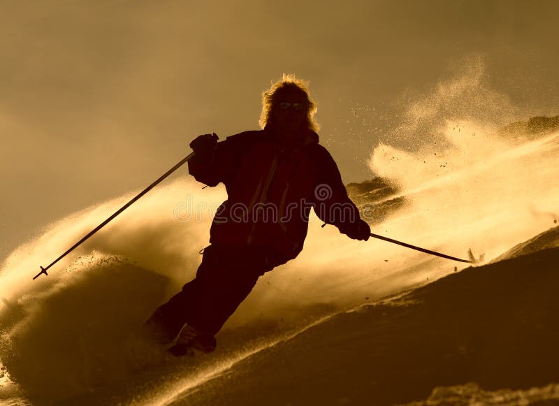 Skier in cloude of powder stock photography