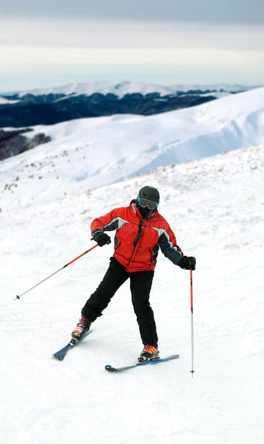 Skier man in snow mountains