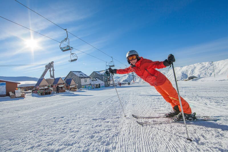 Skier is posing at camera at Gudauri resort in high mountaing of