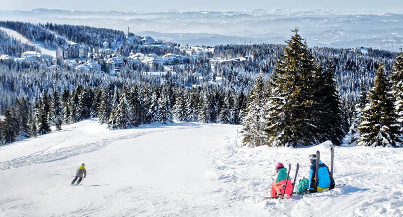 Skiers admiring the view of mountain in Kopaonik winter ski resort  Serbia