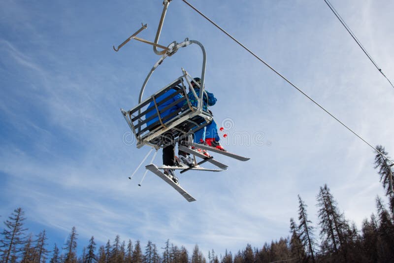 Skiers in chair lift stock photo. Image of dolomites 37163038