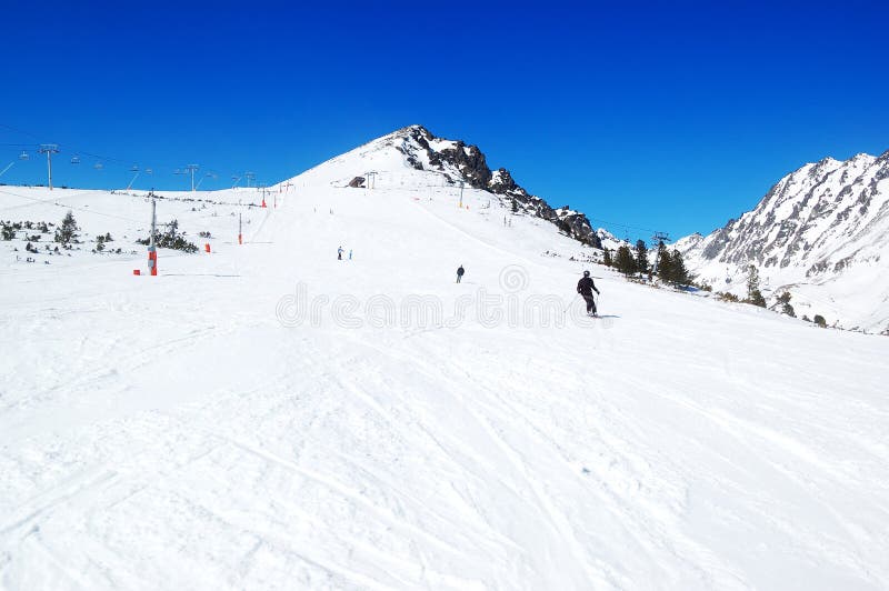 Skiers riding on a slope in Strbske Pleso ski resort