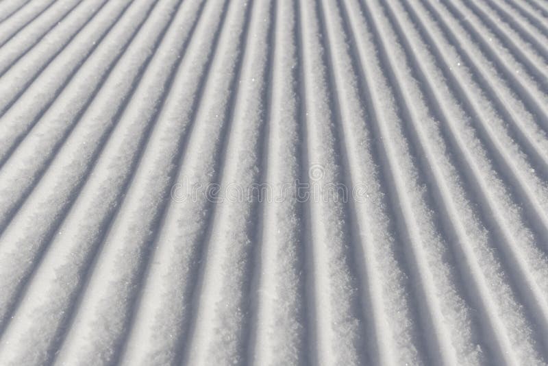 Skiing background - fresh snow on ski slope in the dolomites