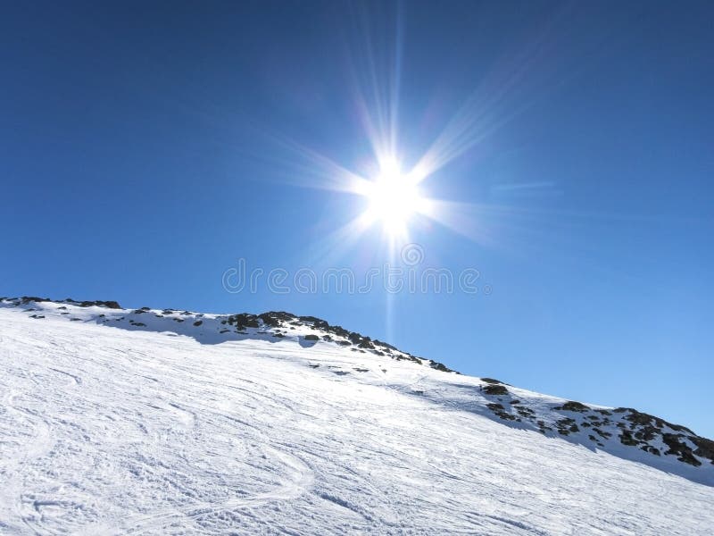 Skiing in French alps with a sun reflection royalty free stock photos Skiing in French alps with a sun reflection royalty free stock photos