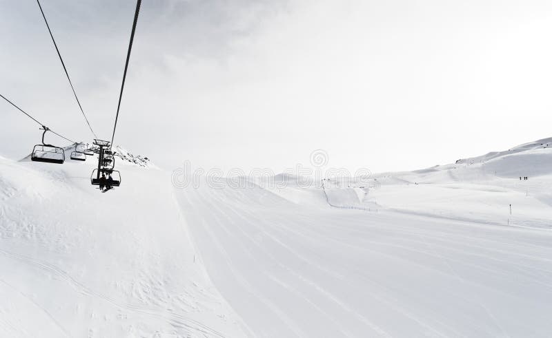 Skiing tracks and ski lift in Paradiski area, France