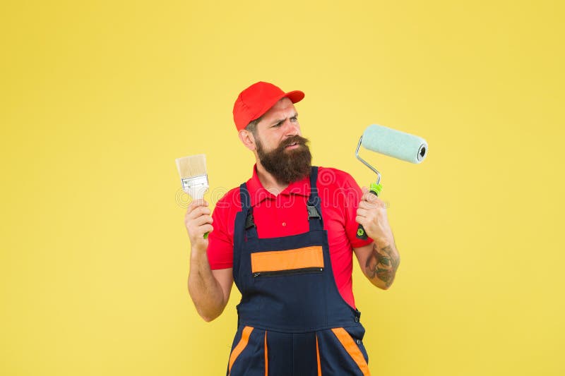 Skilled architect repair and fix. bearded worker. Hard worker with painting brush and roller. Construction worker ready royalty free stock images Skilled architect repair and fix. bearded worker. Hard worker with painting brush and roller. Construction worker ready royalty free stock images