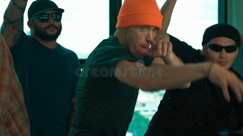 Skilled hipster pose at camera with multicultural friend at building. Endeavor. stock photography