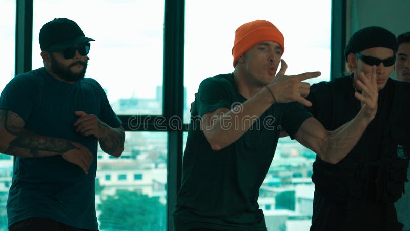 Skilled hipster pose at camera with multicultural friend at building. Endeavor. stock photo