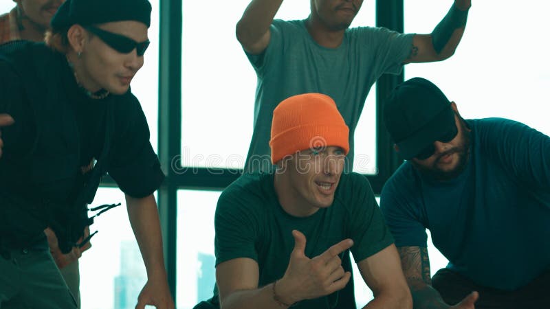 Skilled hipster pose at camera with multicultural friend at building. Endeavor. stock image